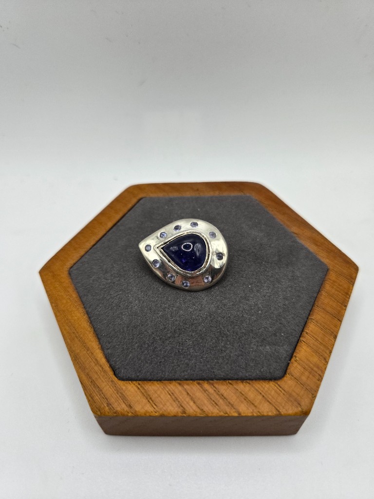 Sterling Silver Brooch set with 8.30ct Pear Tanzanite Cabochon and 2.3mm Tanzanite